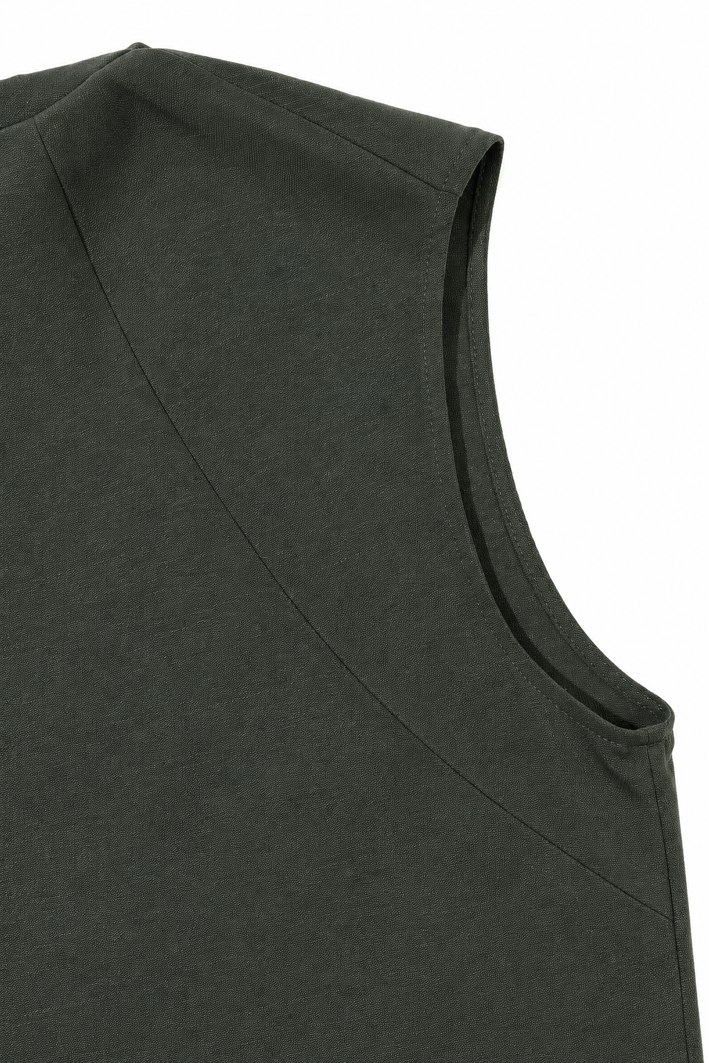 Close-up of a sleeveless dark olive green top showing the shoulder seam and neckline against a plain white background.